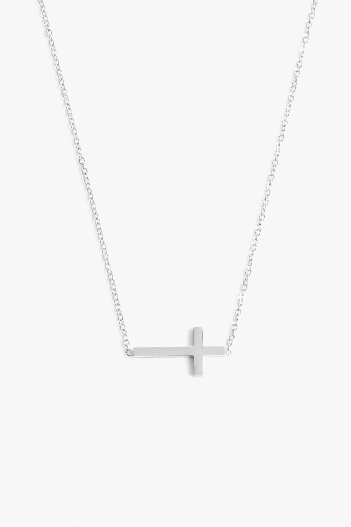 Marrin Costello Jewelry Barry Necklace sideways cross necklace with lobster clasp closure and extender. Waterproof, sustainable, hypoallergenic. Polished stainless steel.