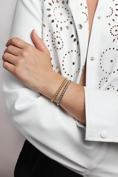 Marrin Costello wearing Marrin Costello Jewelry Crown XL Cuff dot adjustable bracelet. Waterproof, sustainable, hypoallergenic. 14k gold plated and polished stainless steel.