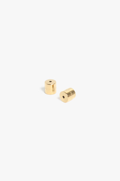 Marrin Costello Jewelry custom earring backings. Cylindrical shaped, for extra comfort and security. 14k gold plated stainless steel. 