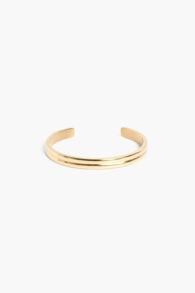 Marrin Costello Jewelry Petra Cuff double band adjustable bracelet with cuff opening. Waterproof, sustainable, hypoallergenic. 14k gold plated stainless steel.