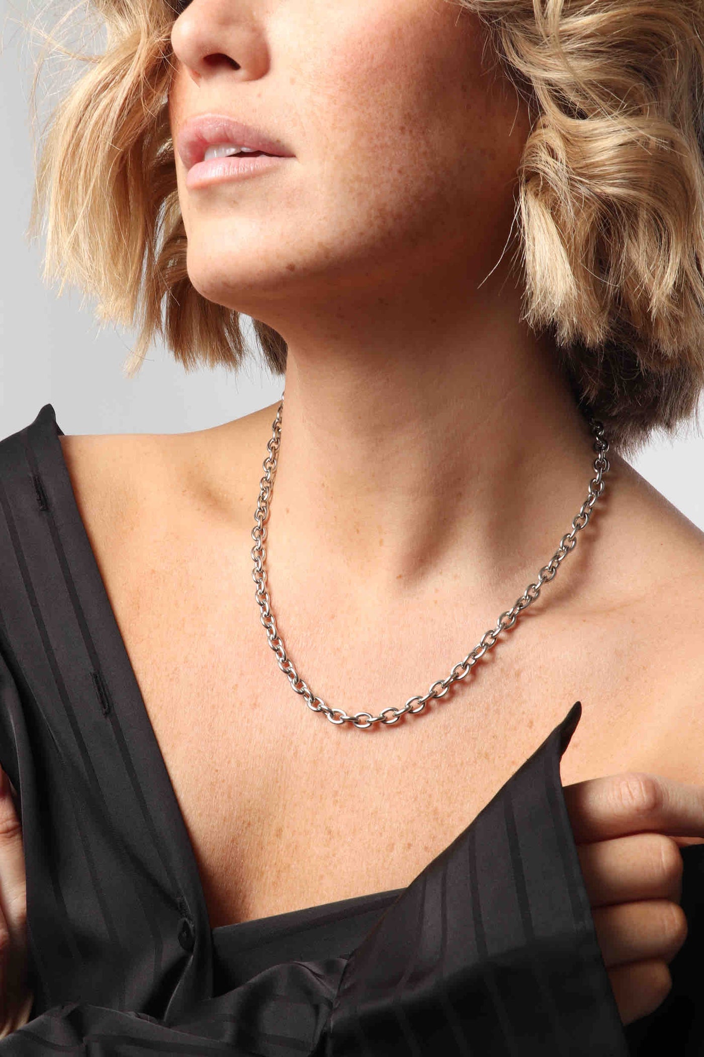 Marrin Costello wearing Marrin Costello Jewelry Mica Chain round link chain with lobster clasp closure and extender. Waterproof, sustainable, hypoallergenic. Polished stainless steel.