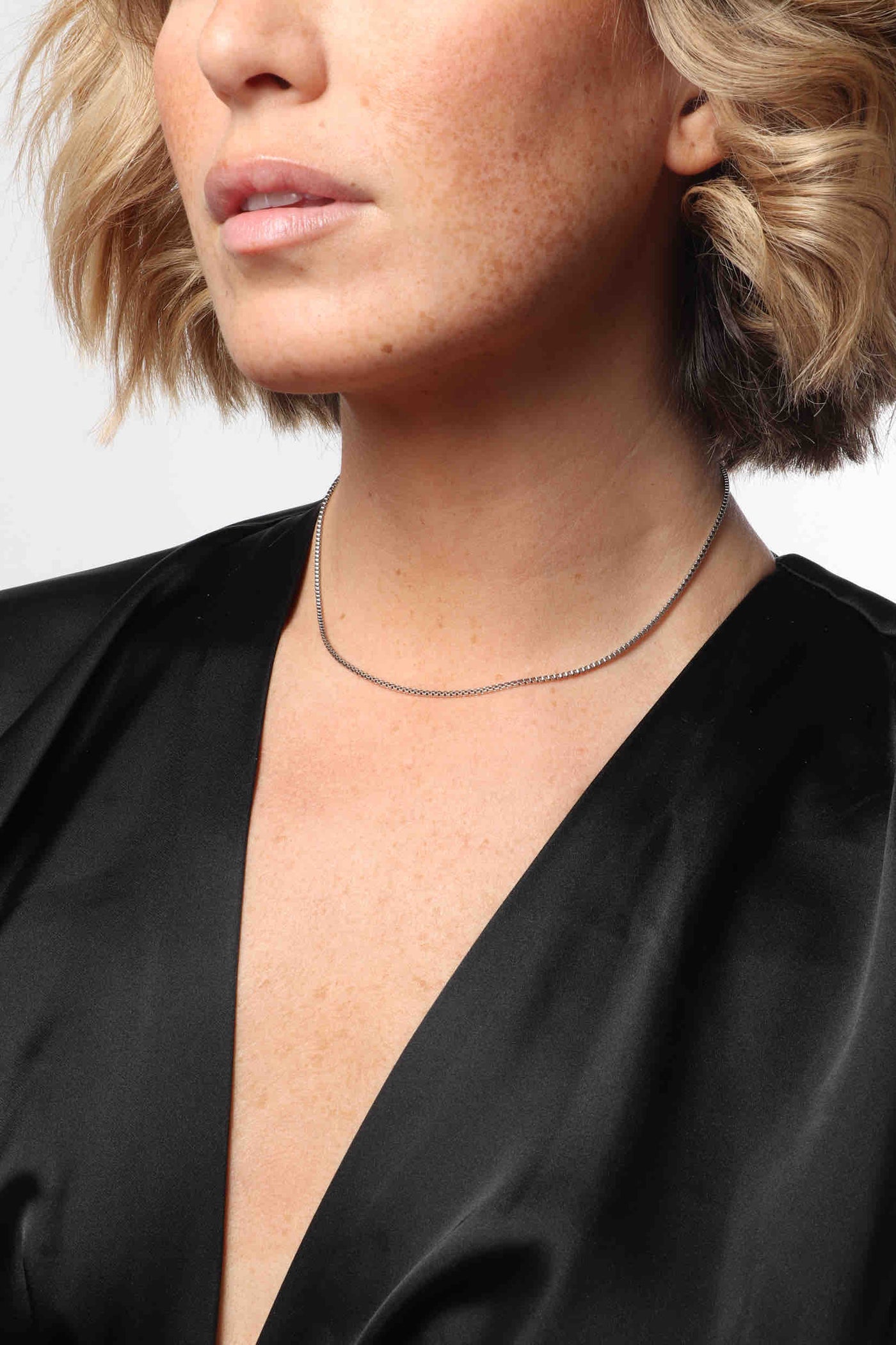 Marrin Costello wearing Marrin Costello Jewelry Nile Choker delicate dainty box link chain with lobster clasp closure and extender. Waterproof, sustainable, hypoallergenic. Polished stainless steel.
