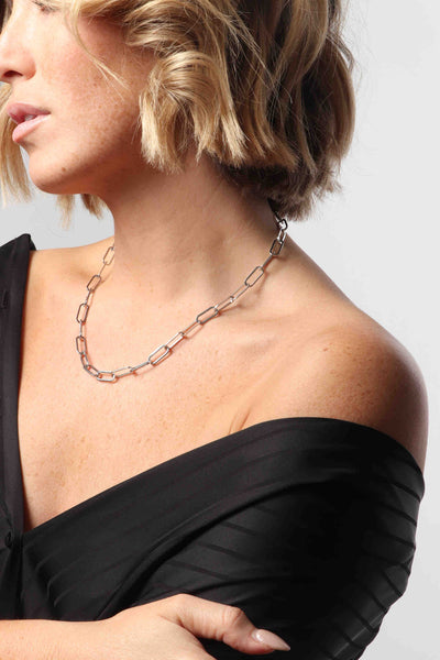 Marrin Costello wearing Marrin Costello Jewelry Ochse Chain paperclip chain necklace with lobster clasp closure and extender. Waterproof, sustainable, hypoallergenic. Polished stainless steel.