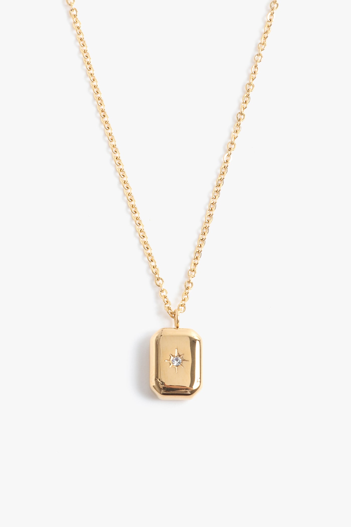 Marrin Costello Jewelry Orion Signet Pendant necklace with square pendant. Pendant is engraved with a star and CZ detail with spring ring clasp closure and extender. Waterproof, sustainable, hypoallergenic. 14k gold plated stainless steel.