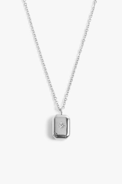 Marrin Costello Jewelry Orion Signet Pendant necklace with square pendant. Pendant is engraved with a star and CZ detail with spring ring clasp closure and extender. Waterproof, sustainable, hypoallergenic. Polished stainless steel.