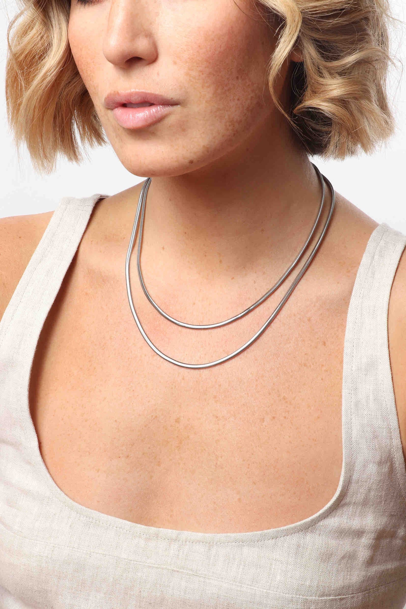 Marrin Costello wearing Marrin Costello Jewelry Ramsey Layers snake herringbone chain layered together 2 in 1 necklace with lobster clasp closure and extender. Waterproof, sustainable, hypoallergenic. Polished stainless steel.