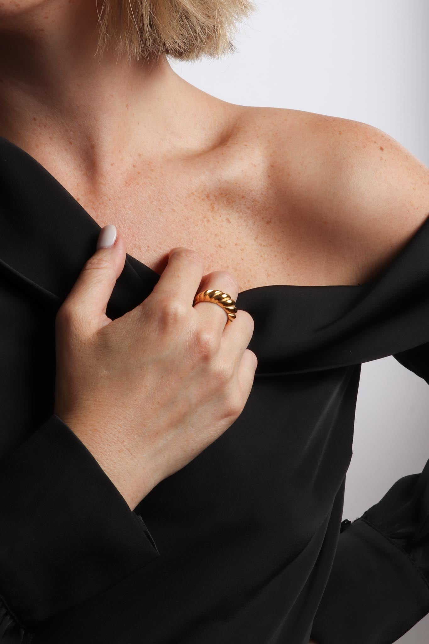 Marrin Costello wearing Marrin Costello Jewelry Rita Ring croissant crescent classic statement ring. Available in sizes 6, 7, 8. Waterproof, sustainable, hypoallergenic. 14k gold plated stainless steel.